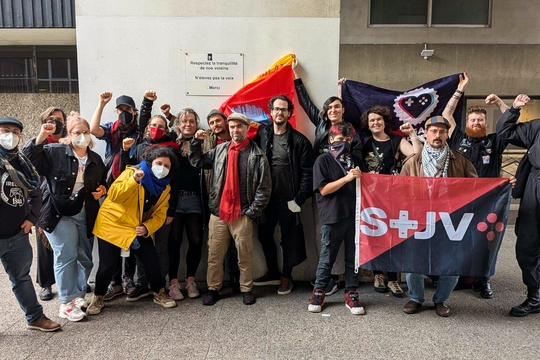 Games workers from unions across Europe hold solidarity fists and their respective trade union flags.