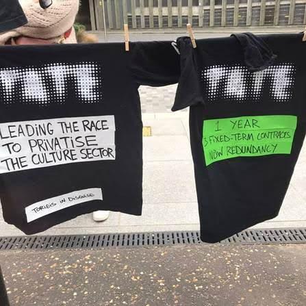 Tate t-shirts being used in a protest action by workers, hung on a drying line